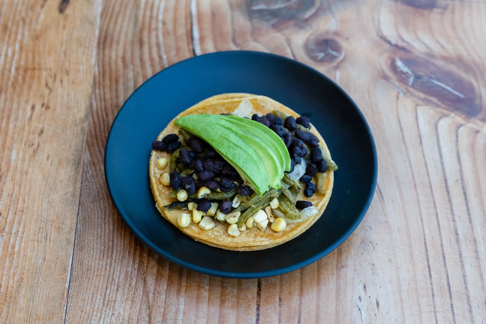 Creamy Refried Beans from the Skillet plated Mexican meal