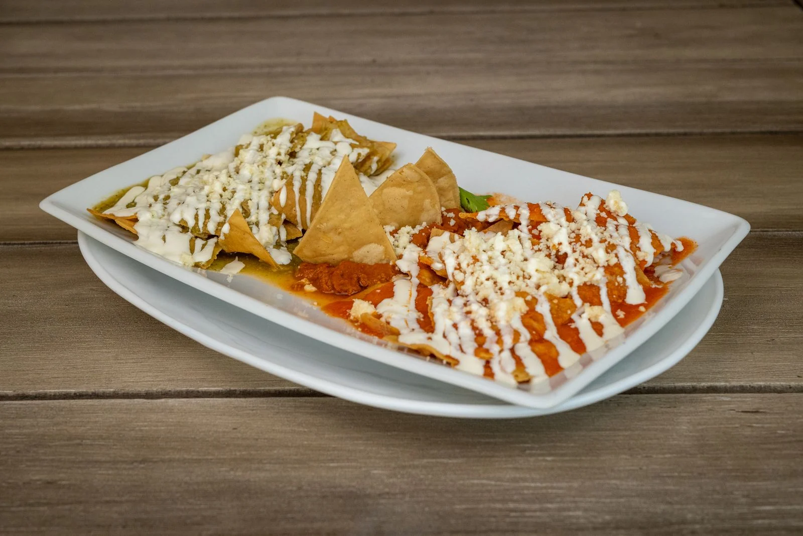 Red-Salsa Chilaquiles with Fried Eggs plated Mexican meal
