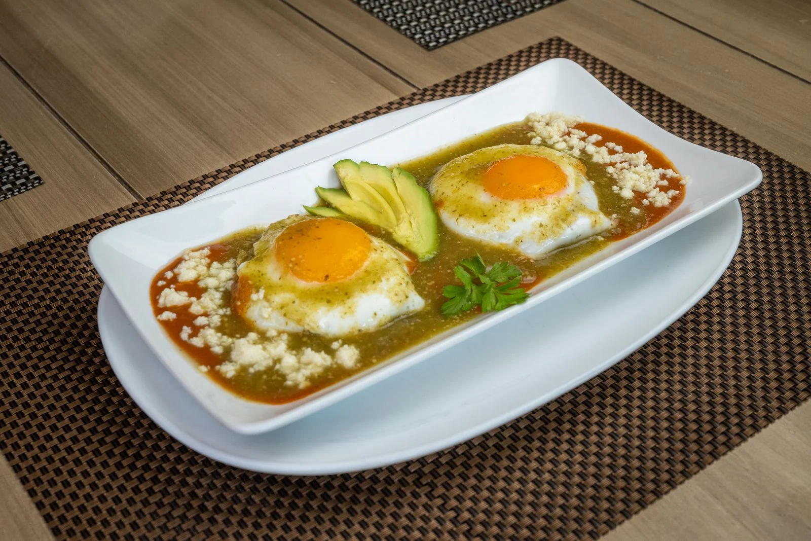 Huevos Rancheros with Smoky Tomato Salsa plated Mexican meal