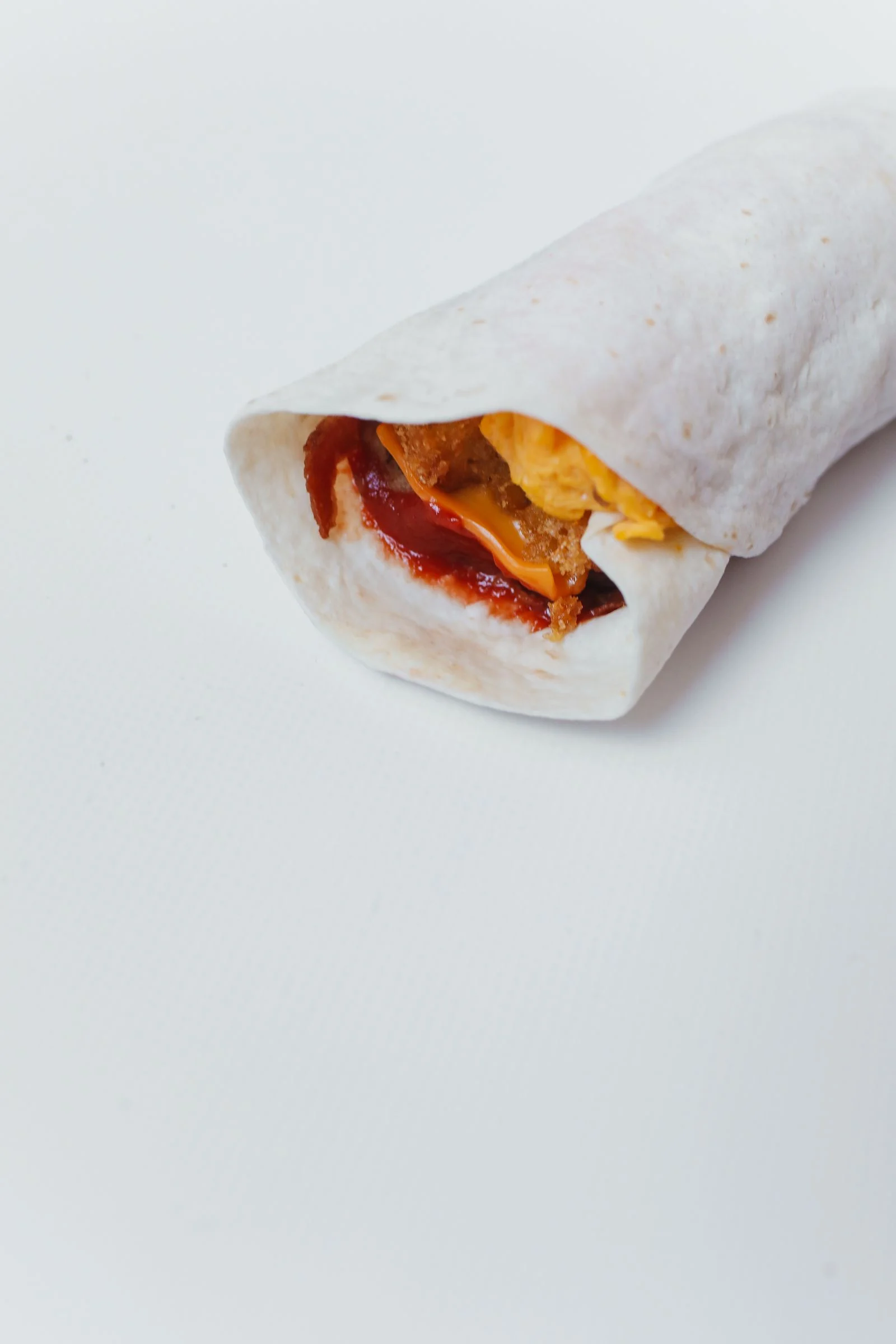 Hearty Breakfast Burrito with Eggs and Beans plated Mexican meal