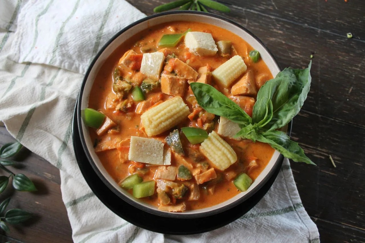 Thai Coconut Red Curry with Chicken plated Thai dinner