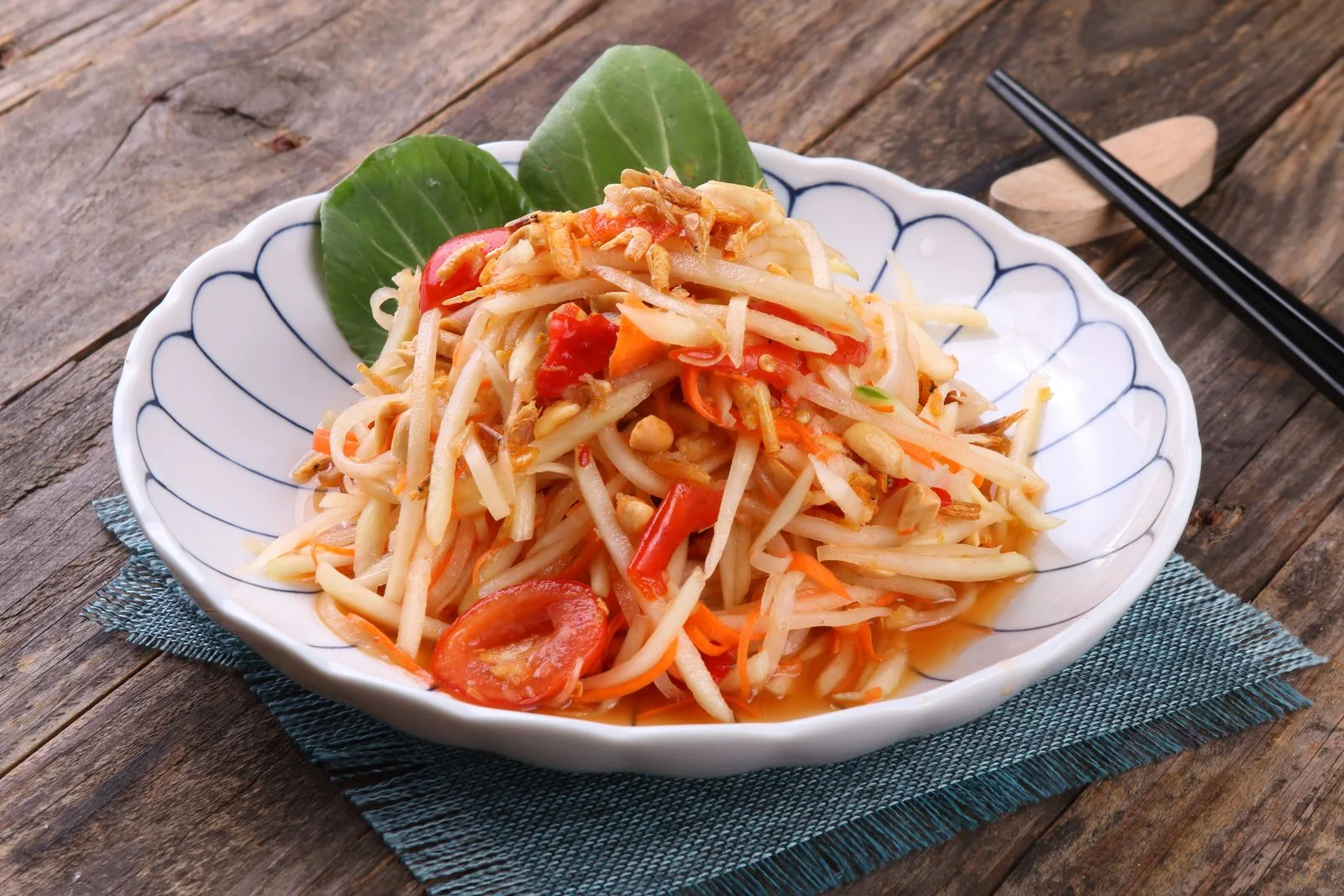 Green Papaya Salad (Som Tum style) plated Thai meal