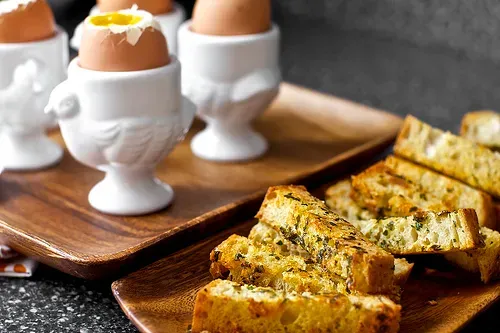 soft eggs with buttery herb-gruyere toasts