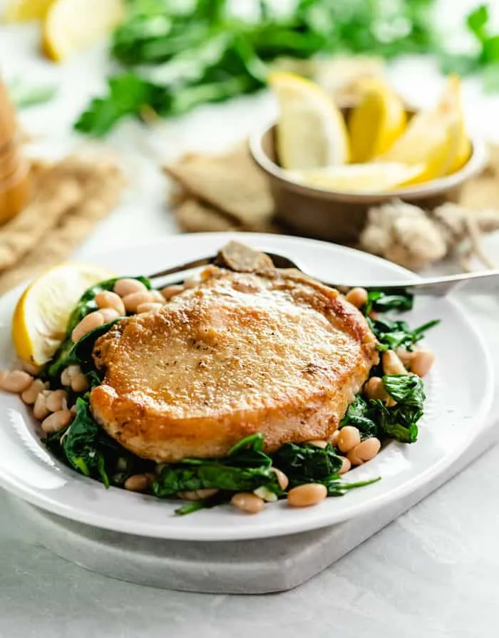 Pan Fried Pork Chops in White Wine Sauce with Spinach and Beans