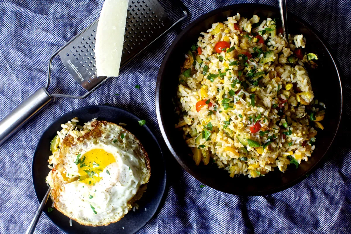 fried rice with zucchini, tomatoes and parmesan