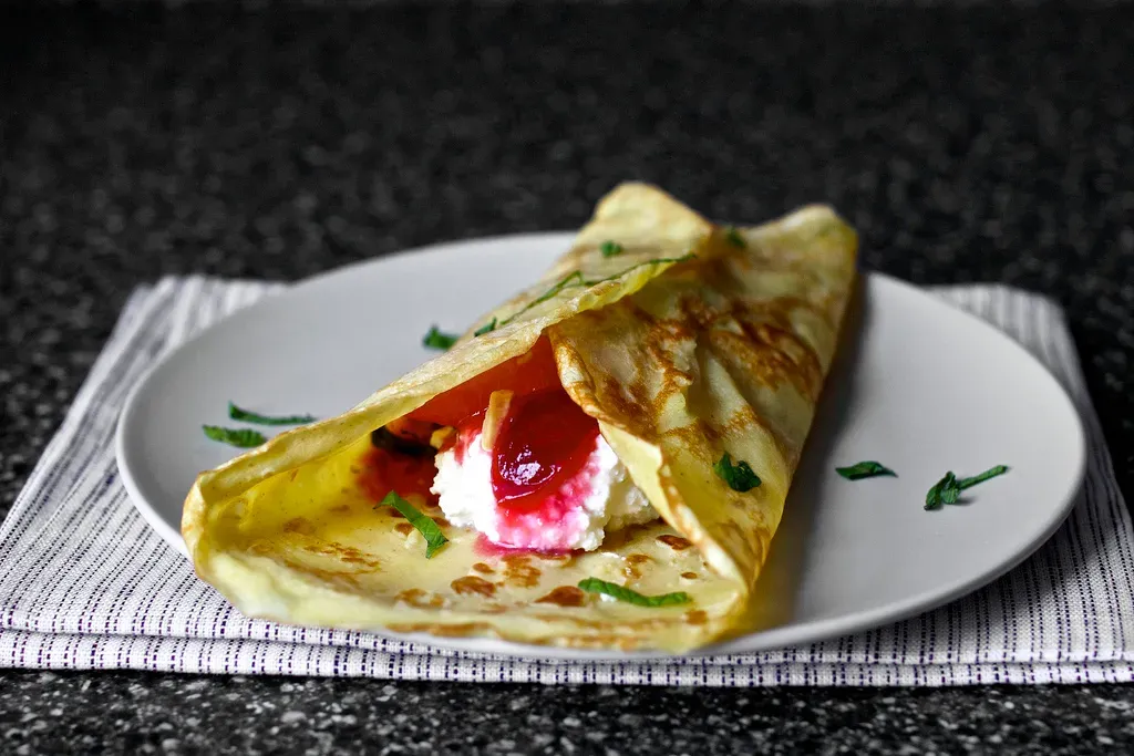 sugar plum crepes with ricotta and honey